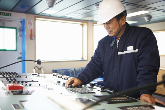Worker using equipment at shipping port, GoSeong-gun, South Korea