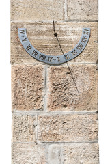 Ancient solar clock on the wall of a rural church in Romania.