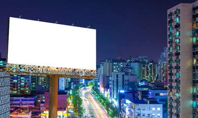Blank billboard for advertisement in city downtown at night