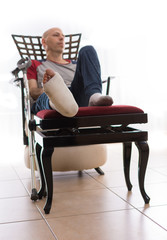 Young man with a broken ankle and a leg cast