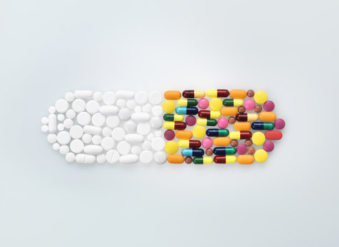 Assorted medical pills and tablets in shape of drug capsule