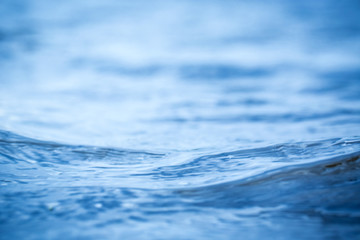 wave on the clean beautiful blue water close up, low Angle view