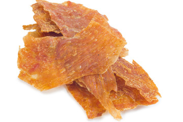 sliced sheets of dried and crispy pork, isolated on white background
