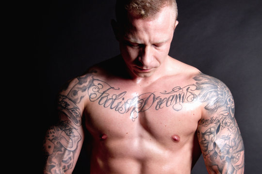 Muscular young man with tattoos