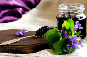 The elderberry jam and a bouquet of violets