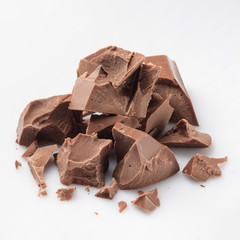 Pieces of milk chocolate isolated on white
