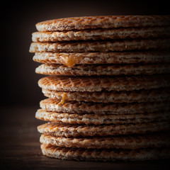 Waffles with caramel on wood