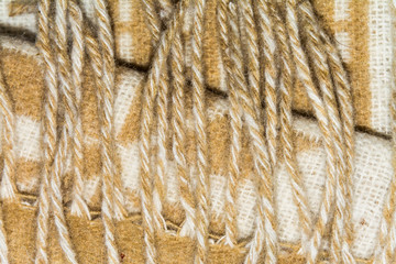 The texture of white and brown twisted woolen threads
