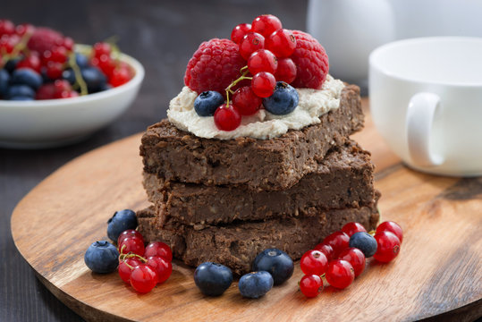 chocolate brownie cake with nuts and fresh berries