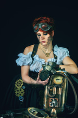 Steam-punk portrait of the girl with the mechanisms on a dark background