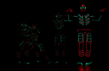 dance team in costumes of the LEDs