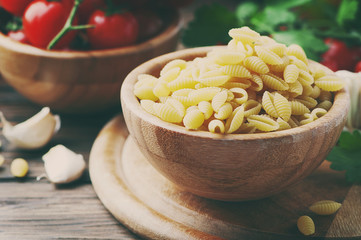 Sardinian uncooked pasta on the wooden table