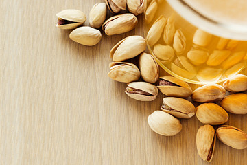 The beer with pistachios. The top view. The bar. The background.
