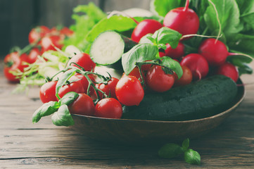 Mix of fresh vegetables on the wooden table