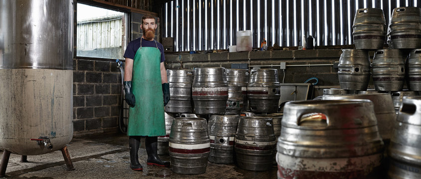 Portrait of a brewery worker in his working environment