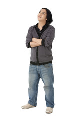 boy with arms crossed at looking up.