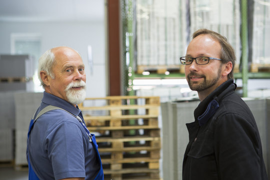 Factory worker with supervisor