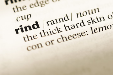 Fototapeta premium Close up of old English dictionary page with word rind