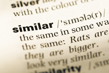 Obraz premium Close up of old English dictionary page with word similar