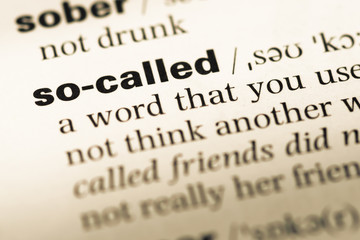 Obraz premium Close up of old English dictionary page with word so called