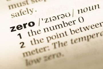 Obraz premium Close up of old English dictionary page with word zero