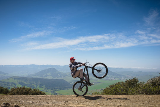 Cyclist pivoting on back wheel, San Luis Obispo, California, United States of America
