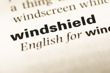 Close up of old English dictionary page with word windshield