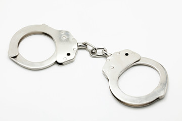 Closed Handcuffs on white isolated background