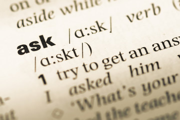 Close up of old English dictionary page with word ask