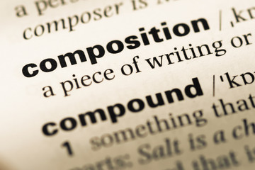 Close up of old English dictionary page with word composition