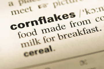 Close up of old English dictionary page with word cornflakes