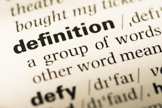 Close up of old English dictionary page with word definition
