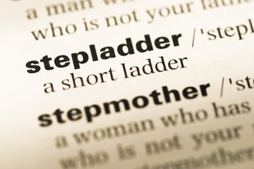 Obraz premium Close up of old English dictionary page with word stepladder