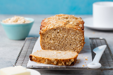 Healthy vegan oat and coconut loaf bread, cake on a cooling rack