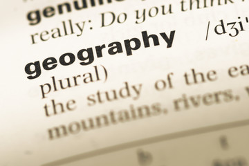 Close up of old English dictionary page with word geography © TungCheung