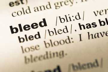 Obraz premium Close up of old English dictionary page with word bleed