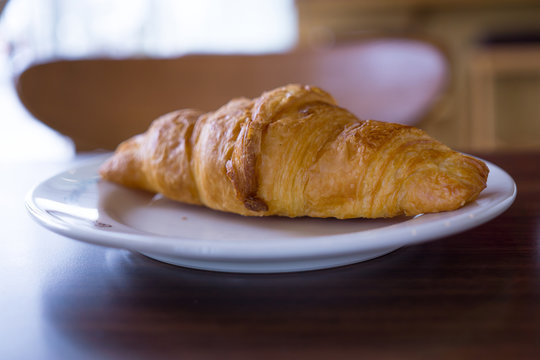 croissants in white plate on the table