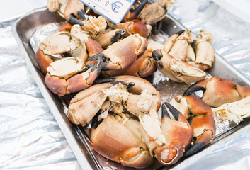 Lobster claws with euro price sign in a market in Paris, France