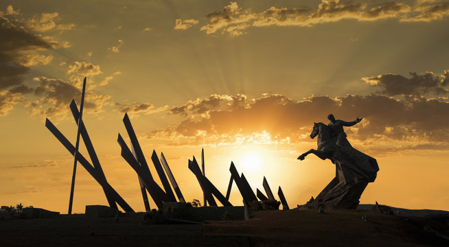 Silhouetted statue at sunset, Plaza de la Revolution, Santiago de Cuba, Cuba