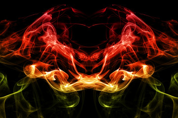 Colored abstract smoke, isolated on black background. Photo. Acid neon color.