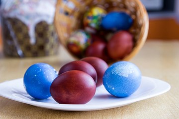 Painted colorful easter eggs and easter cake. Selective focus on eggs
