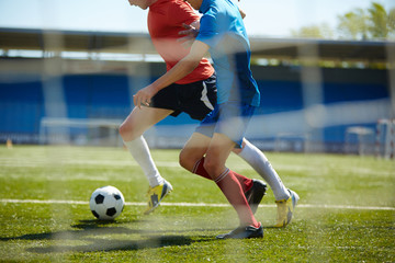 Trying to tackle the ball