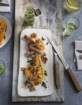 Overhead View Of Roasted Chicken With Herb Garnish