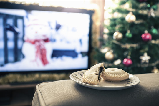 Mince Pies With Missing Bite On Plate