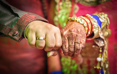 Bridal henna covered hands of an Indian Bride