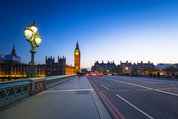 Fototapeta na wymiar London scenery at Westminter bridge with Big Ben and blurred red bus, UK