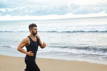 Running Man. Sporty Runner Enjoying Run By Sea During Outdoor Workout. Handsome Fit Athletic Male...