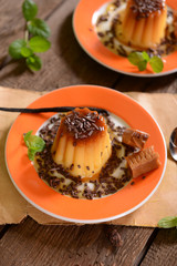 Panna cotta with caramel suce and chocolate flakes