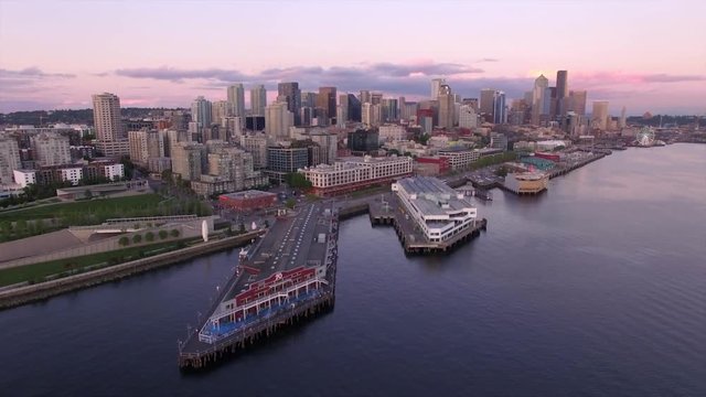 Aerial Pan of Downtown Seattle Skyline Over Water of Elliot Bay