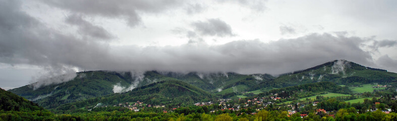 Naklejka premium mountain landscape / mountain landscape with clouds after storm